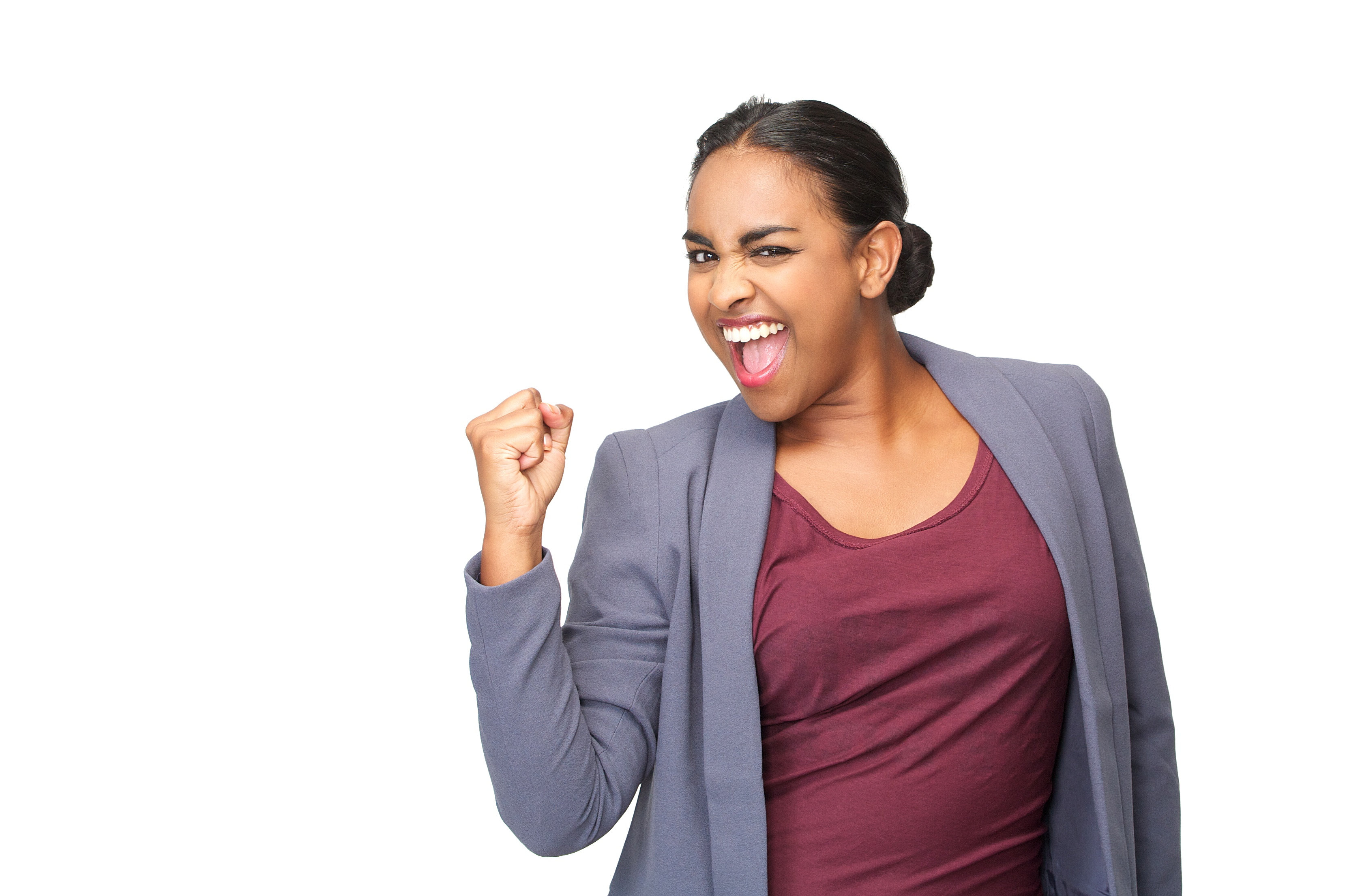 Closeup portrait of a happy young woman celebrating with fist pump